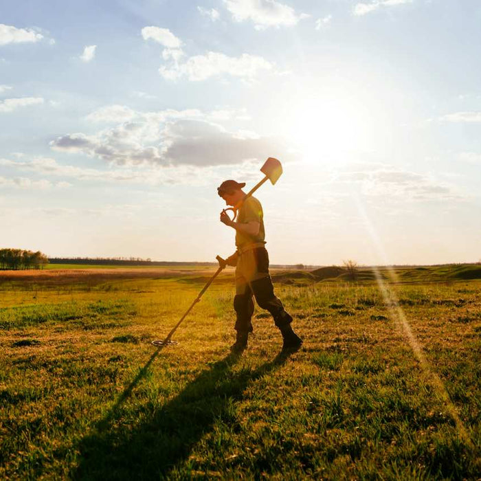 man metal detecting 